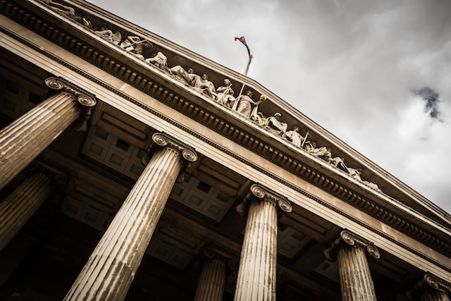 low angle pic of a courthouse with an overcast sky in the background