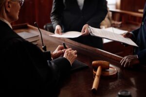 Lawyers discuss a civil accident case in court.