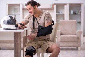 Injured man with arm in a sling finds out his motorcycle accident claim was denied.