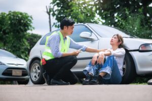 An emergency responder discusses a bicycle accident with an injured party.