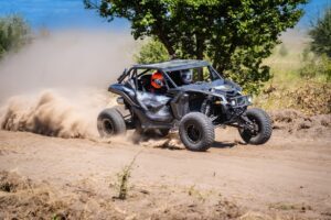 Riders navigate a UTV buggy during a fast ride while wondering what to do after a UTV accident in Wisconsin.